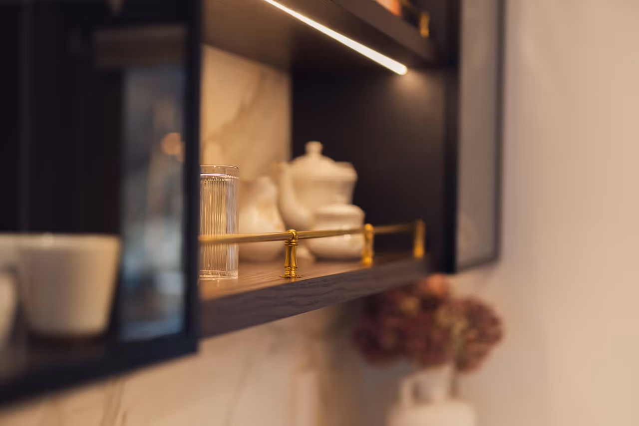 Kitchen remodel in Kelowna — cabinetry and lighting detail Custom cabinet detail with warm lighting in a finished Kelowna kitchen