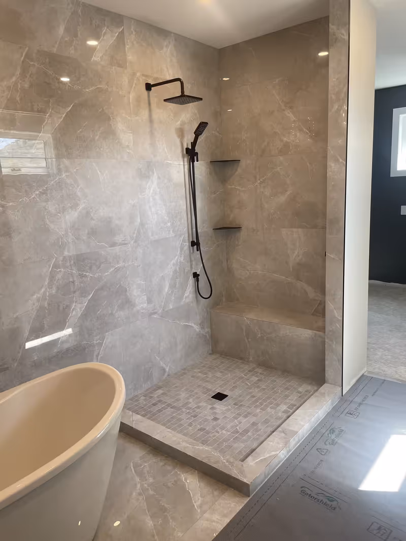 Kelowna bathroom renovation with custom tile and shower glass